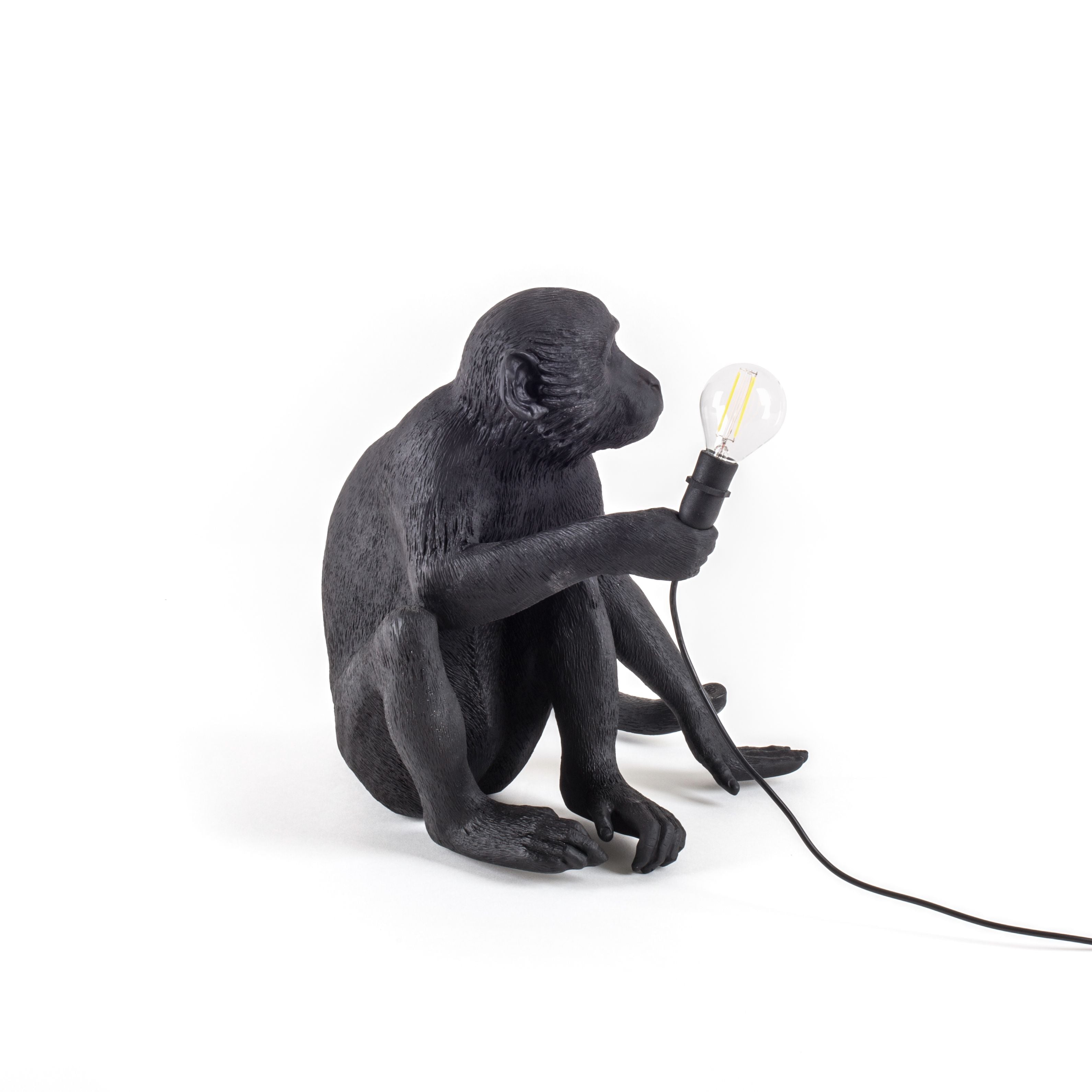 Seletti Monkey Outdoor Lamp Black, der sidder