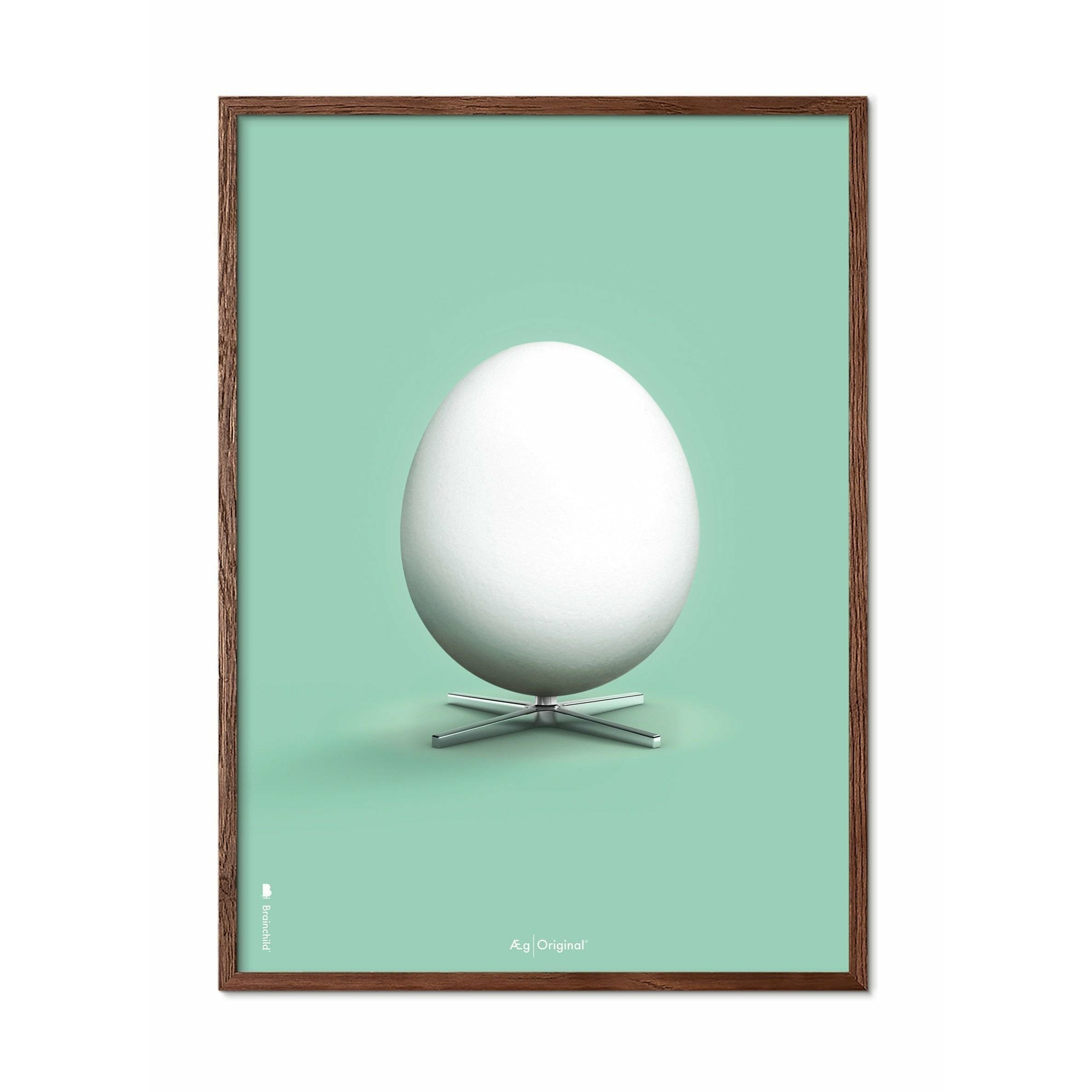 Brainchild Egg Classic Affisch, ram i mörkt trä 70x100 cm, mintgrön bakgrund