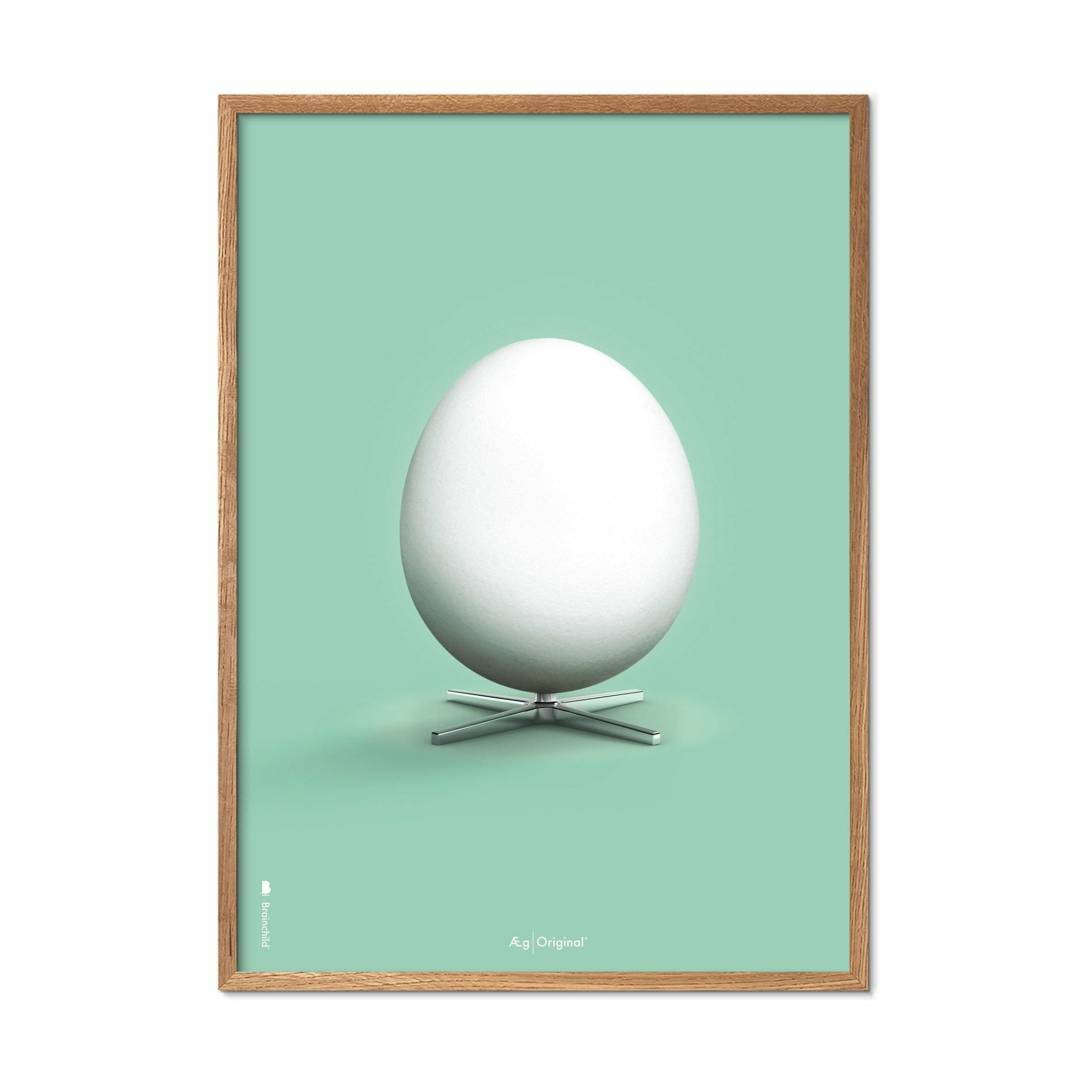 Brainchild Egg Classic Affisch, ram i lätt trä 70x100 cm, mintgrön bakgrund